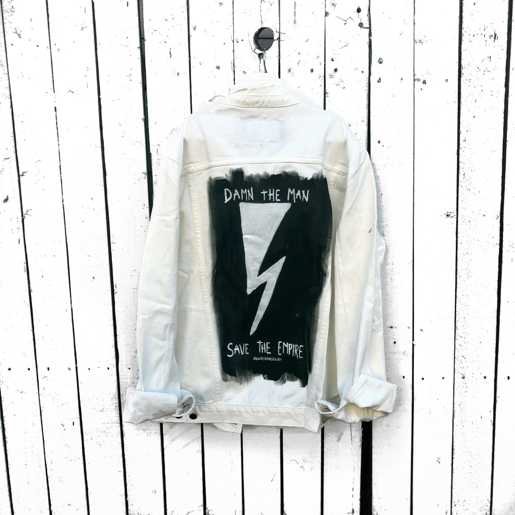 White denim wash. 'Damn The Man Save The Empire' in black and white. Signed @wrenandglory.