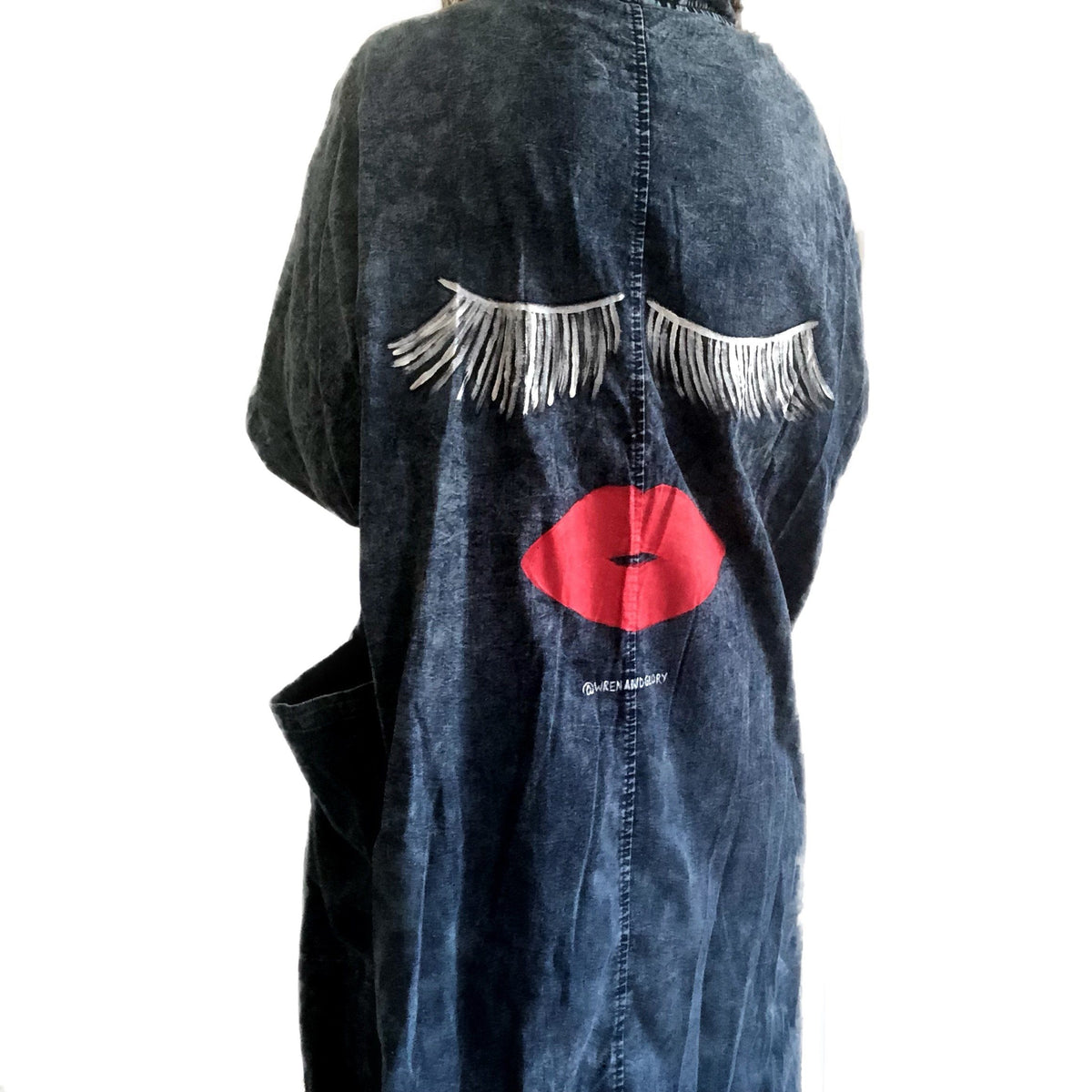 Darker blue denim wash. Eyes and lips painted on back, with 'We Gonna Start The revolution' painted in white along the entire collar. Signed @wrenandglory.