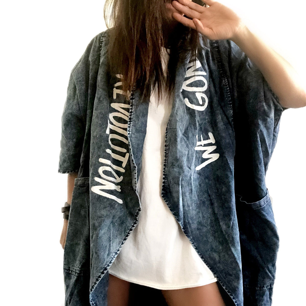 Darker blue denim wash. Eyes and lips painted on back, with 'We Gonna Start The revolution' painted in white along the entire collar. Signed @wrenandglory.
