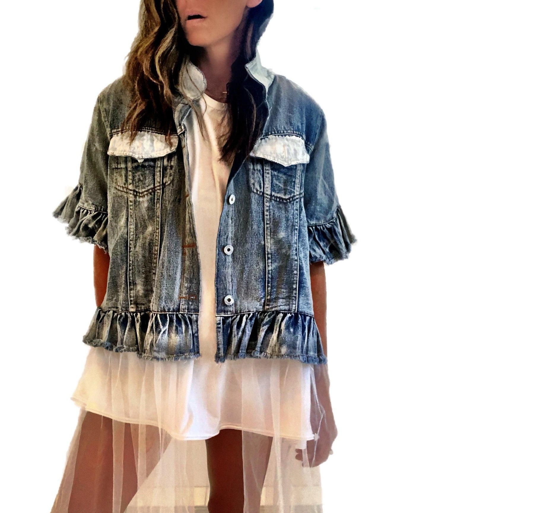 Medium blue denim short sleeve jacket with layer of long white tulle. Surfs up hand symbol painted in white on the back, with rings on the fingers. Collar and front pockets painted in white. Signed @wrenandglory.