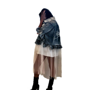 Medium blue denim short sleeve jacket with layer of long white tulle. Surfs up hand symbol painted in white on the back, with rings on the fingers. Collar and front pockets painted in white. Signed @wrenandglory.