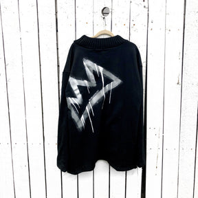 Slight mock neck black sweater. Large silver crown, with white drip effect, on back. Signed @wrenandglory.
