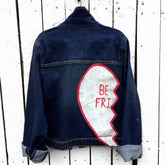 Medium blue denim wash. Broken hearts, one on each jacket, with BEST FRIENDS split up between the 2 jackets. White stripes on diagonal on fronts, pockets painted white. Signed @wrenandglory.
