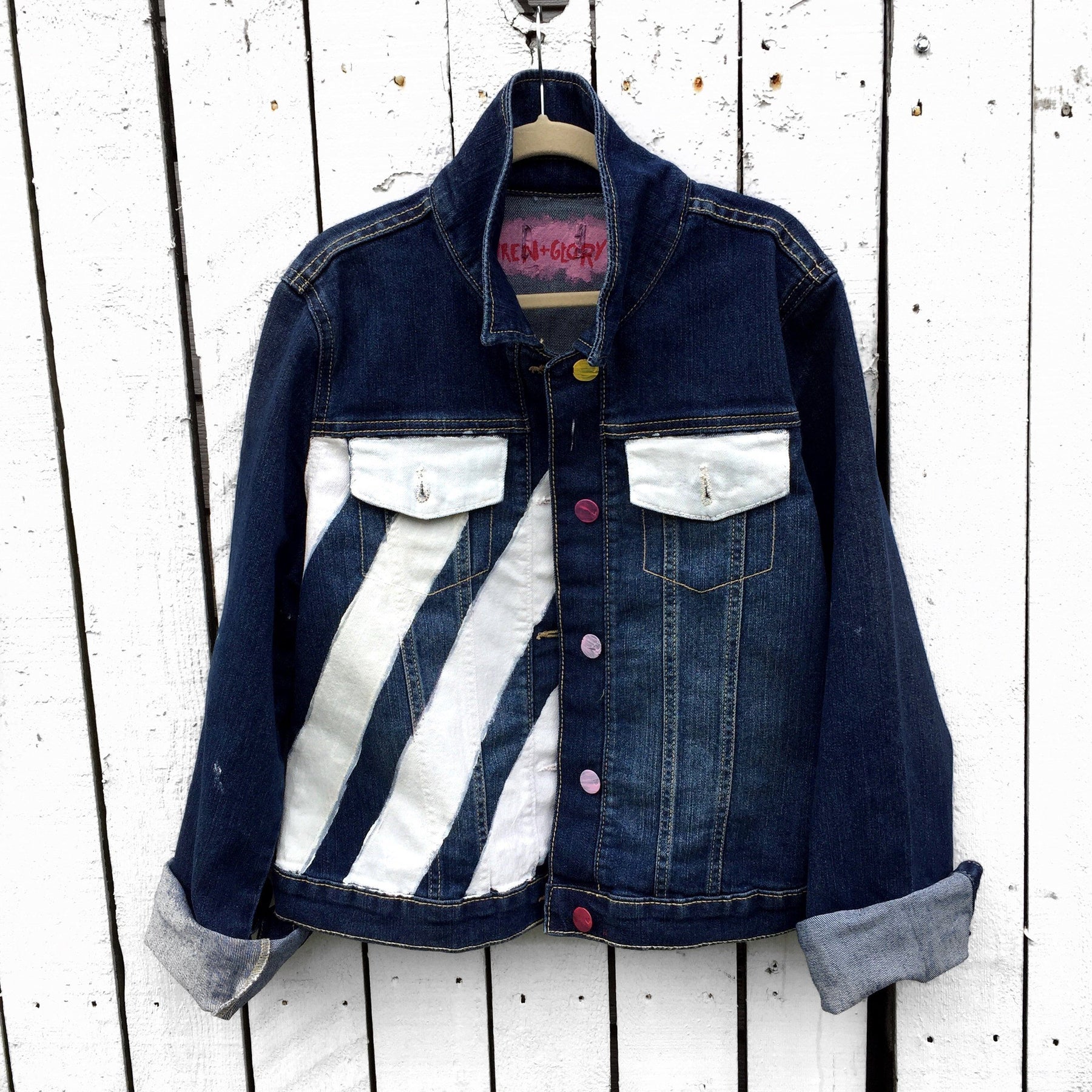 Medium blue denim wash. Broken hearts, one on each jacket, with BEST FRIENDS split up between the 2 jackets. White stripes on diagonal on fronts, pockets painted white. Signed @wrenandglory.