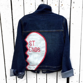 Medium blue denim wash. Broken hearts, one on each jacket, with BEST FRIENDS split up between the 2 jackets. White stripes on diagonal on fronts, pockets painted white. Signed @wrenandglory.