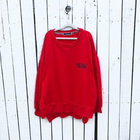 Oversized red sweatshirt. Silhouette of cat painted in black on back, with MEOW painted on front upper side. Signed @wrenandglory.