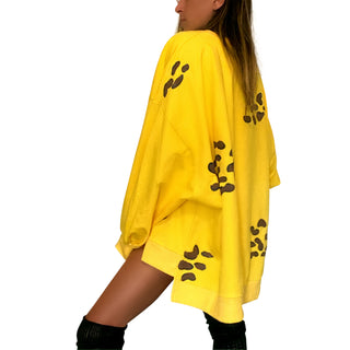 Oversized yellow crewneck sweatshirt. Cheetah pattern painted throughout in brown and black. Signed @wrenandglory.