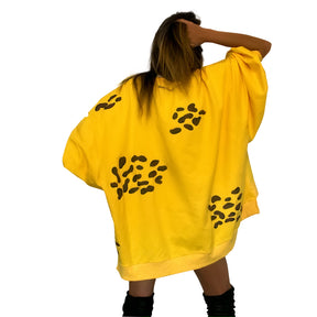 Oversized yellow crewneck sweatshirt. Cheetah pattern painted throughout in brown and black. Signed @wrenandglory.