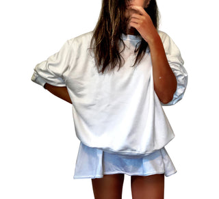 Oversized white sweatshirt. Lips and vampire teeth painted in on back, with with BITE ME painted above. Signed @wrenandglory.