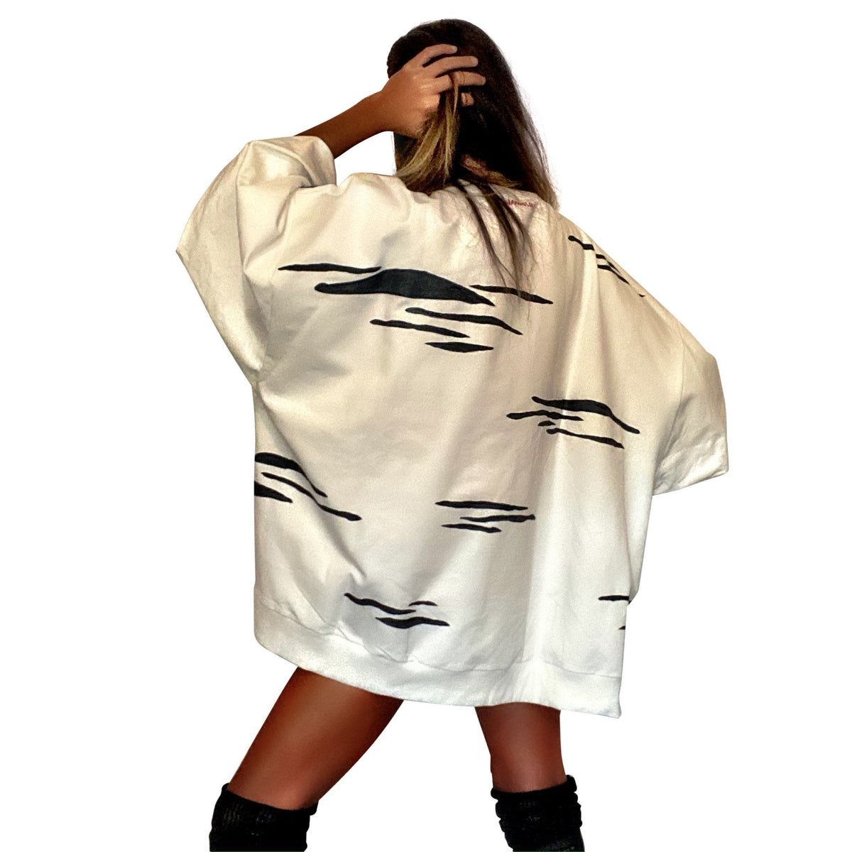 Oversized white crewneck sweatshirt. Zebra pattern painted throughout in black. Signed @wrenandglory.