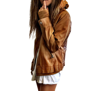 Light brown, faux leather jacket with tan sweatshirt lining the inside, with good and thumbholes at sleeves. Tree trunk painted across entire back in dark brown, with heart carved out and ' ___ + ___' painted inside. Please specify names above. Signed @wrenandglory.