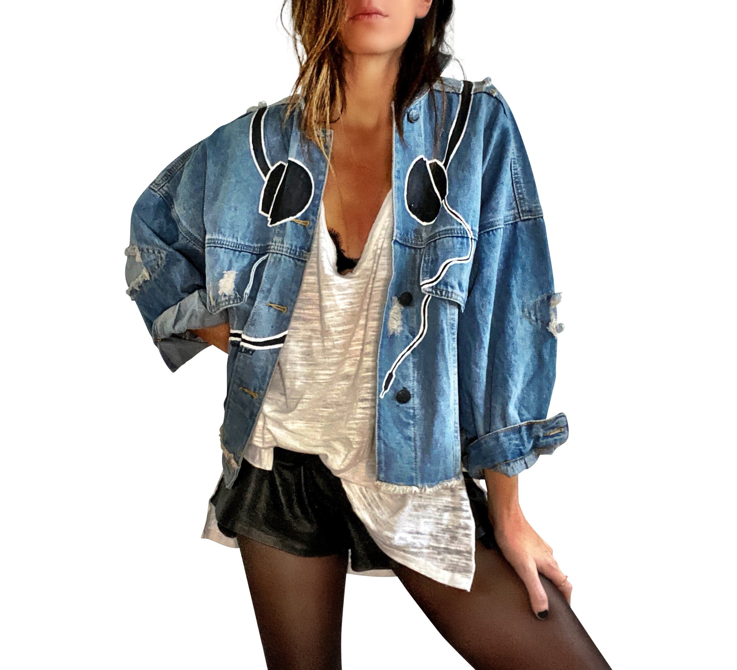 Light blue denim wash. Black headphones with white putline painted around the entire top of jacket, with 'please dont stop the music' painted in black with white outline around bottom edge. Signed @wrenandglory.