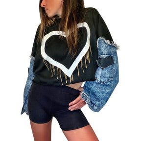 Cropped sweatshirt with denim sleeves. Large heart painted in white, with gold drip effect. Heart side can be worn on the front or on the back. Black painted on pockets of sleeves. Signed @wrenandglory.