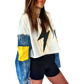 Cropped sweatshirt with denim sleeves. Large lightning painted in black, with yellow drip effect. Yellow painted on pockets on sleeves. Lightning side can be worn on the front or on the back. Signed @wrenandglory.