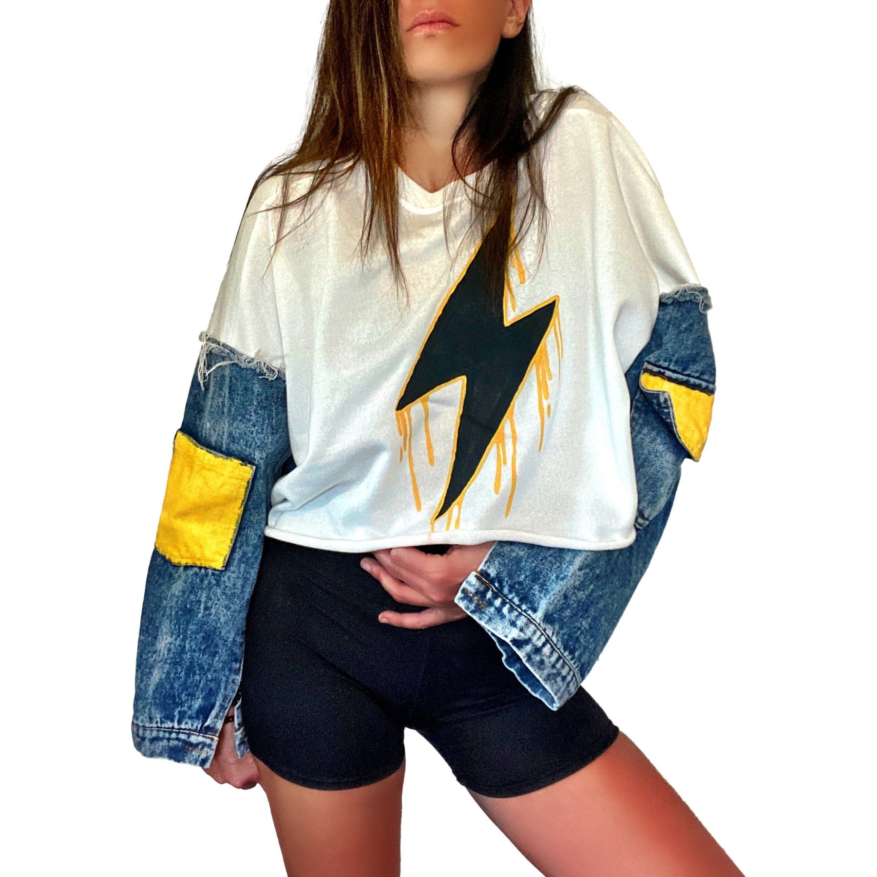 Cropped sweatshirt with denim sleeves. Large lightning painted in black, with yellow drip effect. Yellow painted on pockets on sleeves. Lightning side can be worn on the front or on the back. Signed @wrenandglory.
