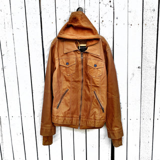 Tan, faux leather jacket with Brown hooded sweatshirt lining the inside and thumbholes at sleeves. 'F*CK DRAMA LET'S PARTY' painted along back of sleeves and upper back of jacket, in black, with white outline. Signed @wrenandglory.