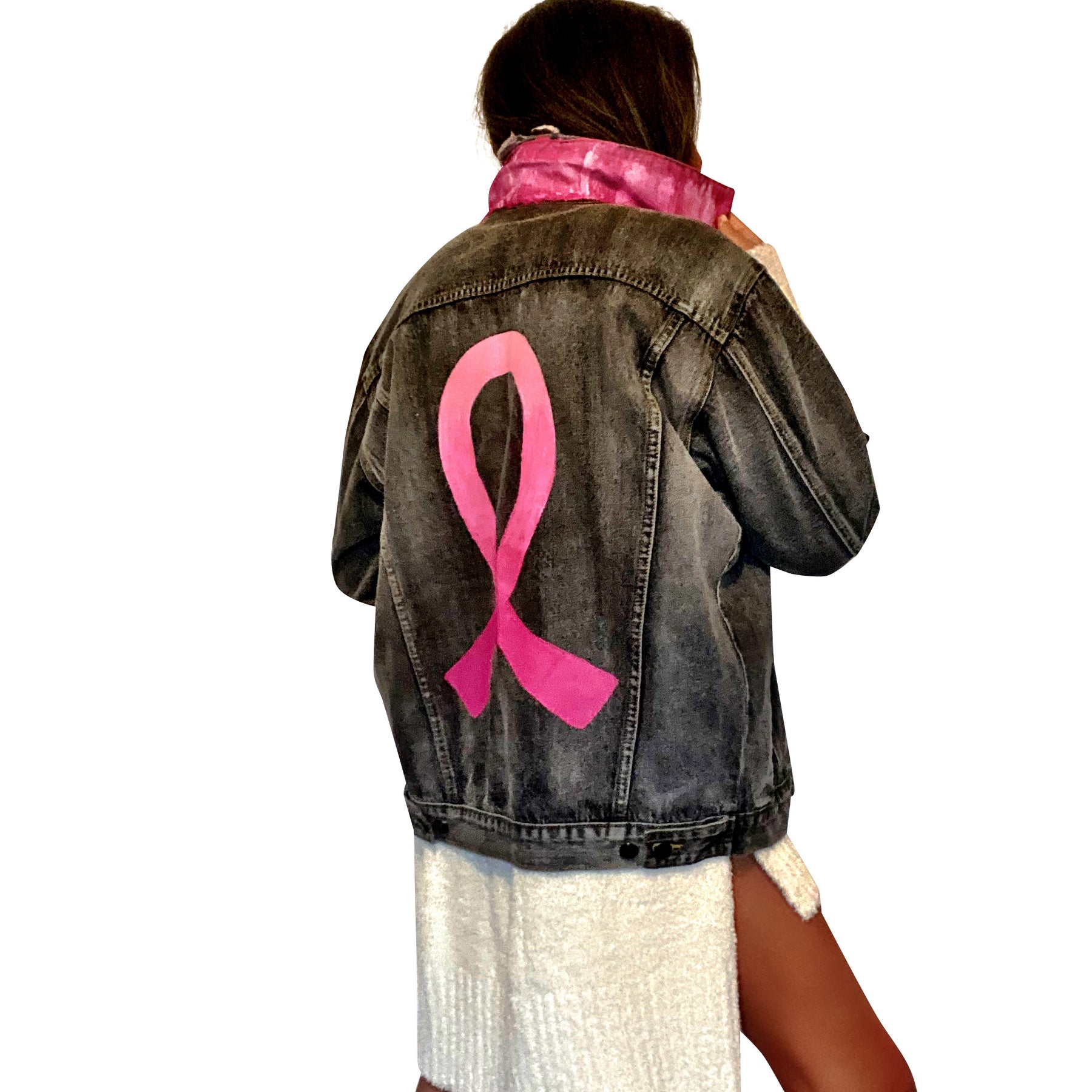 Faded black denim. Pink ombre Breast Cancer ribbon painted in large on back. Love, Strength, Trust, Beauty, Peace, Hope, Passion, Faith, Power painted in light & bright pink on the front. Collar painted in pink ombre. Signed @wrenandglory.