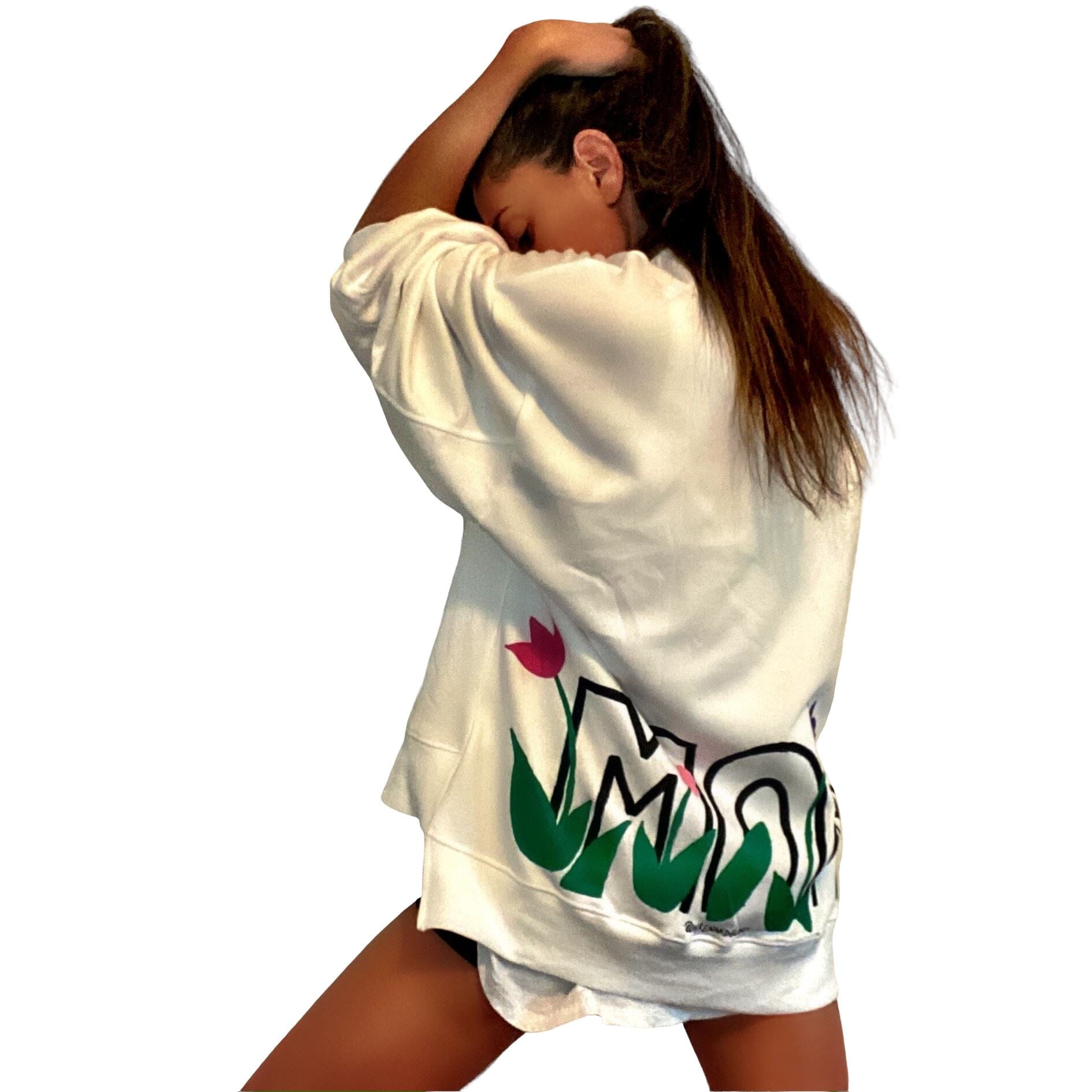 Oversized white sweatshirt. 'MOM' painted in on back, coming up from bottom hem, with flower pattern painted throughout letters. Customized upper back with names of children, grandchildren, husband, etc. Up to 8 names able to be painted. Small red embroidered heart on each lower sleeve. Signed @wrenandglory.