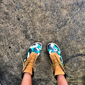 Green, white and black camo style painted boots. Painted on waterproof Timberland Boots. Signed @wrenandglory.