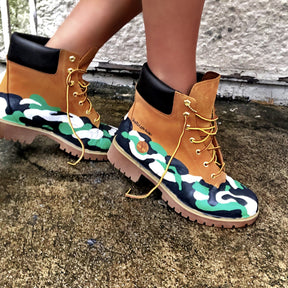 Green, white and black camo style painted boots. Painted on waterproof Timberland Boots. Signed @wrenandglory.