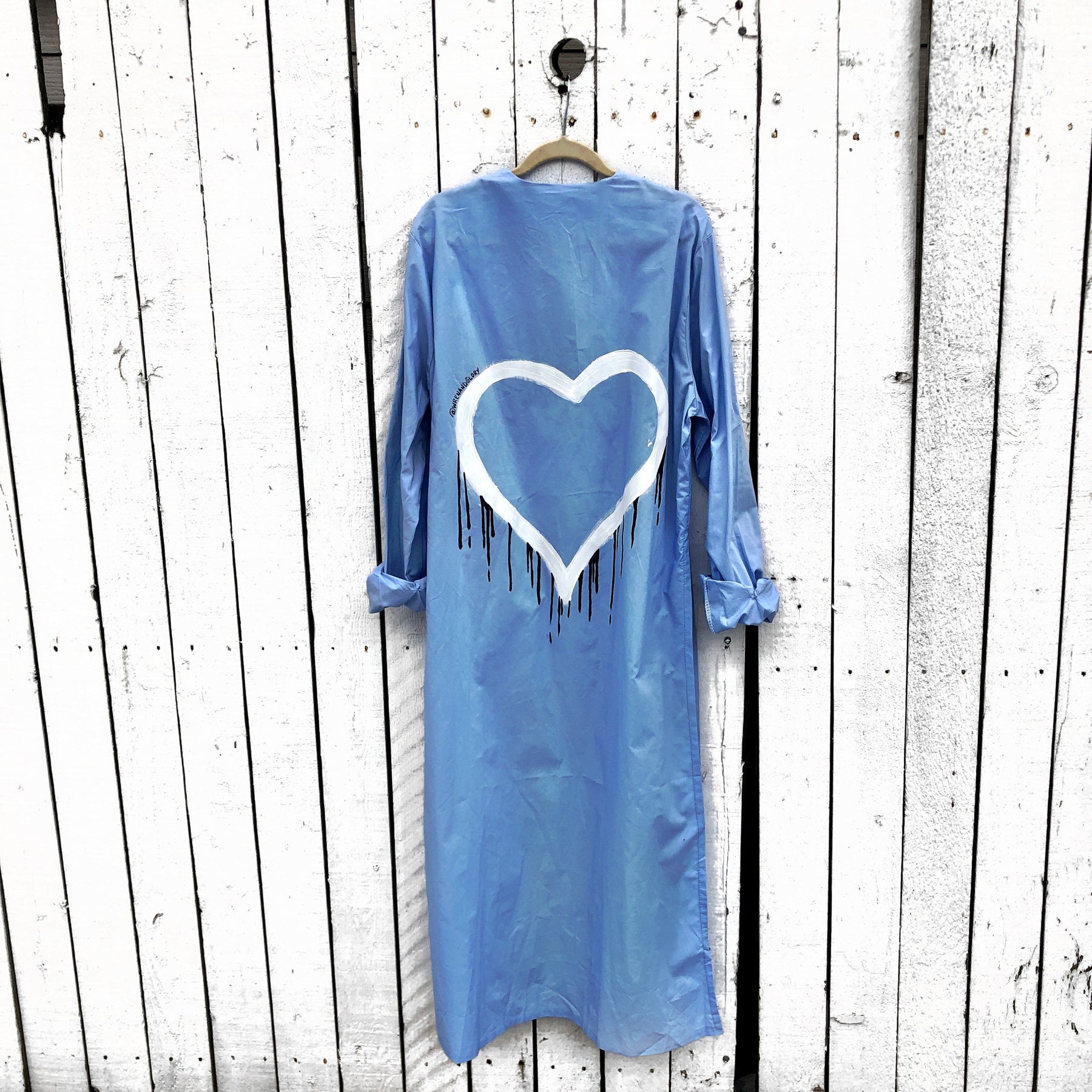 Slim fitting light blue shirt/dress, with belt. White heart with black painted drip. Can be worn as a shirt or a dress. Signed @wrenandglory.