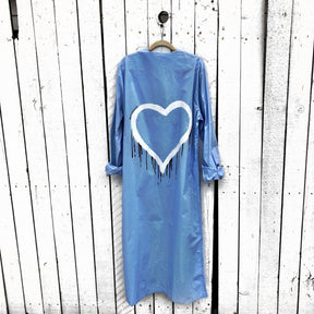 Slim fitting light blue shirt/dress, with belt. White heart with black painted drip. Can be worn as a shirt or a dress. Signed @wrenandglory.