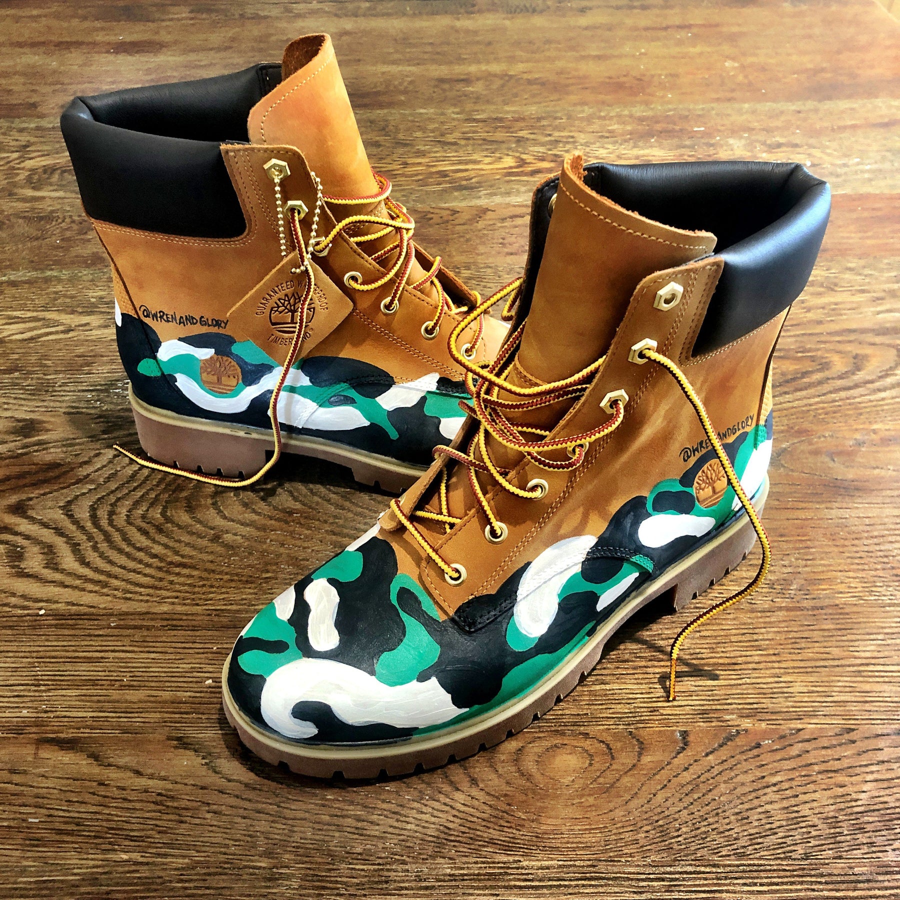 Green, white and black camo style painted boots. Painted on waterproof Timberland Boots. Signed @wrenandglory.