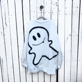 Oversized white sweatshirt. Silhouette of ghost painted in black on back, with BOO painted on front upper side. Signed @wrenandglory.