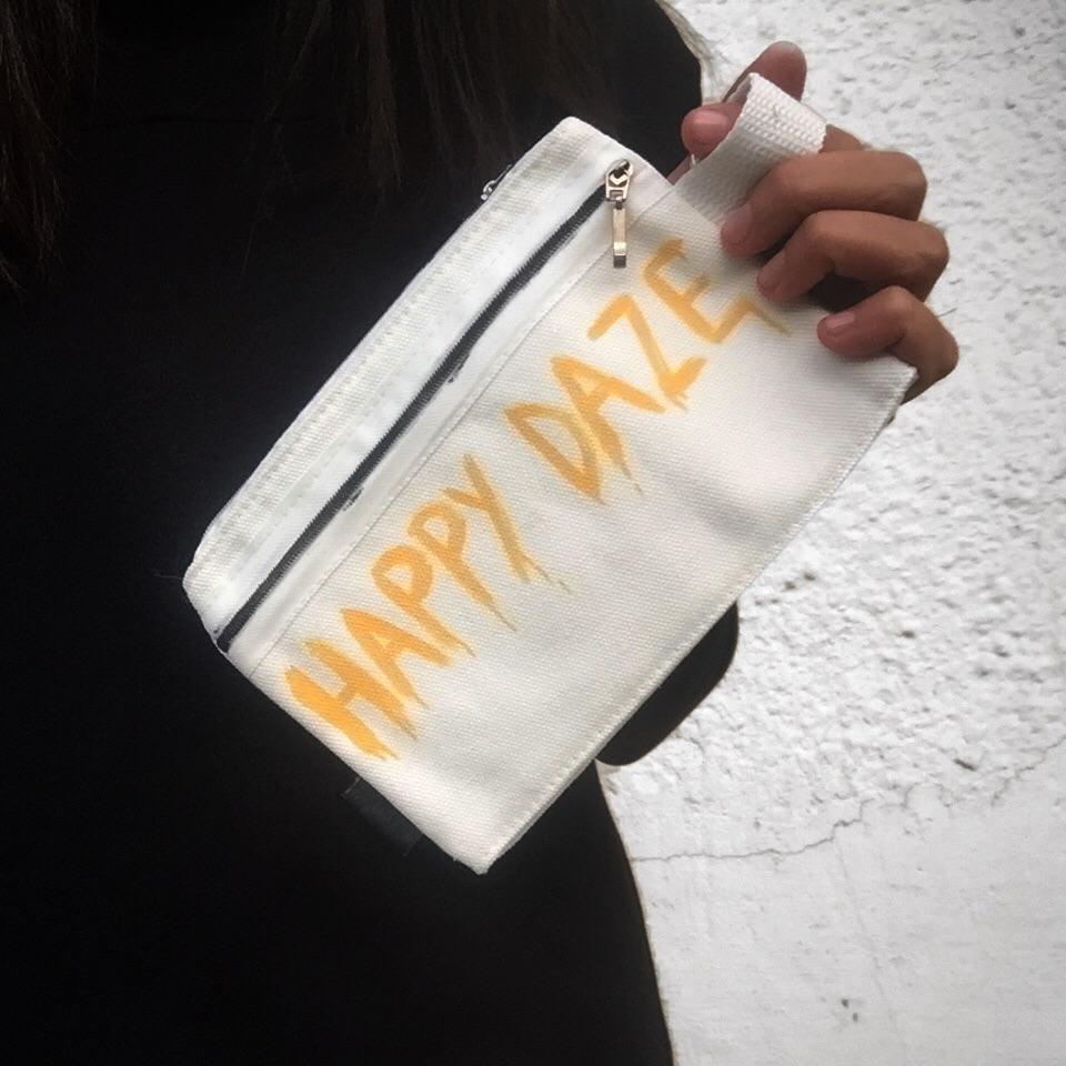 White canvas zippered pouch. Hand painted 'HAPPY DAZE' theme.